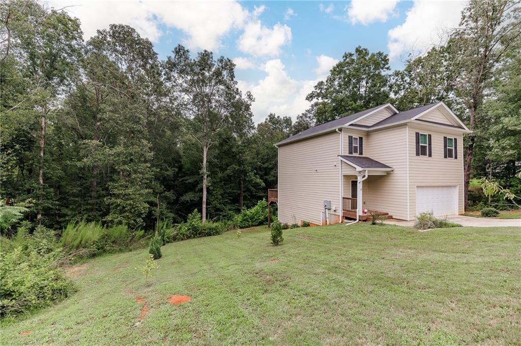 103 Three Rivers Court Hull, GA 30646 - Photo 3 of 40 a view of a house with a yard