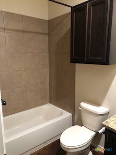 1509 Lucille Street Seguin, TX 78155 - Photo 7 of 11 a white toilet sitting next to a bathtub