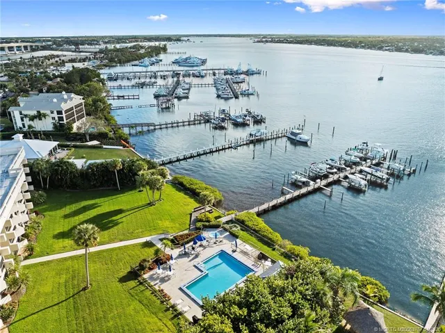 a kitchen with a refrigerator and a stove top oven