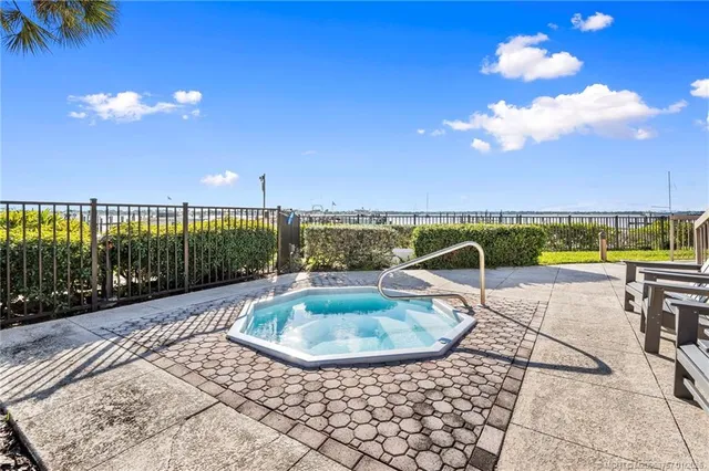 a view of a swimming pool with a lounge chair