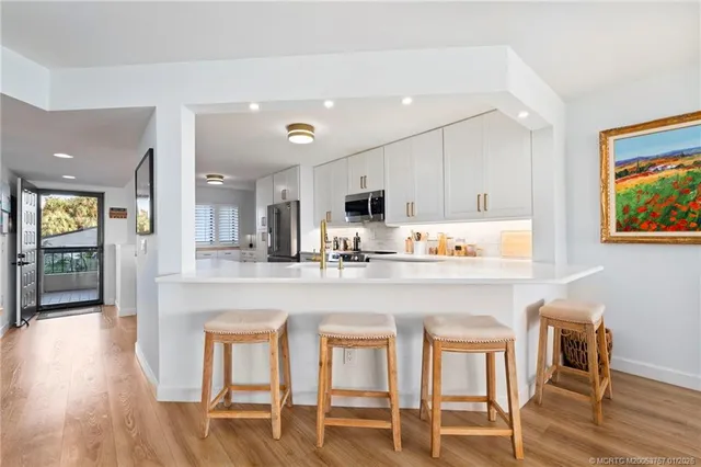 a view of a kitchen with a sink cabinets and a window