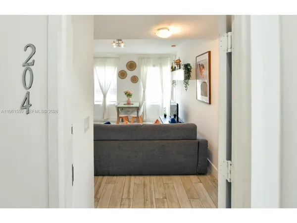 a living room with a couch and a window
