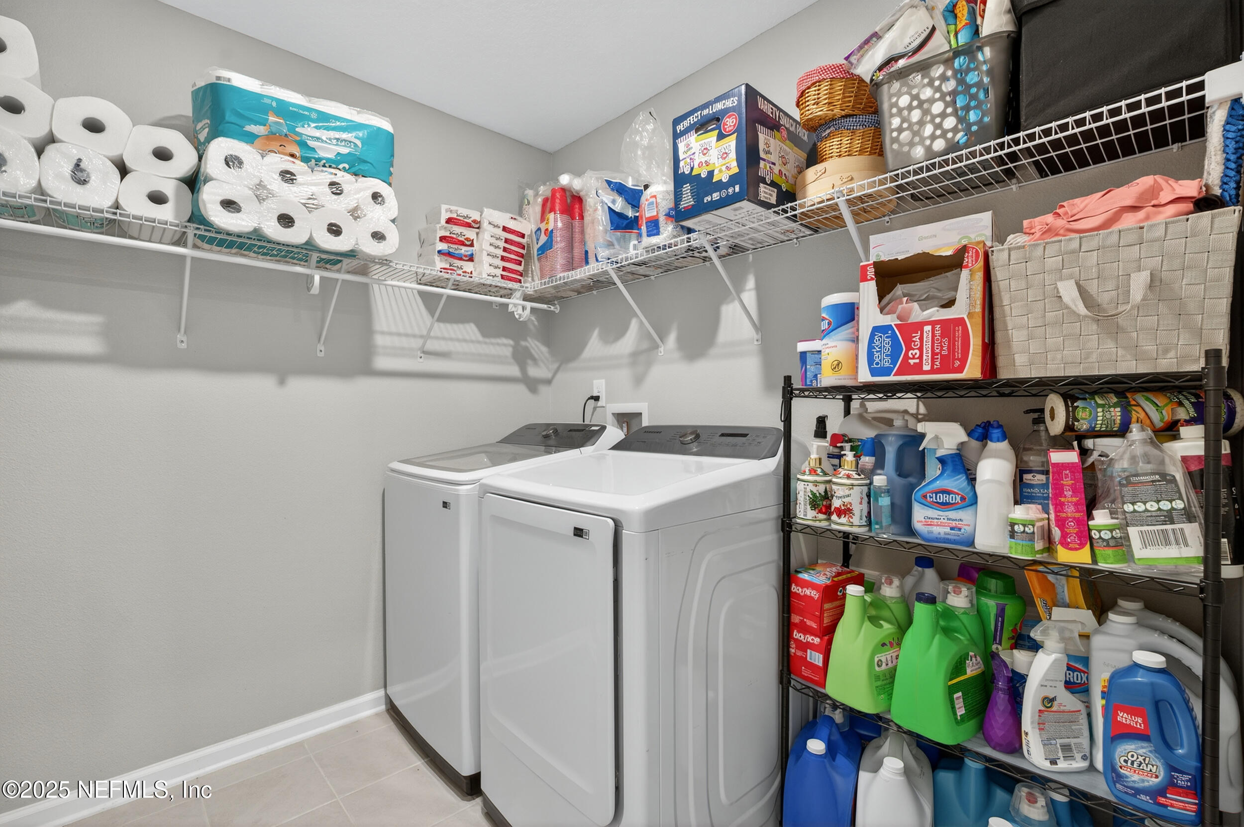 318 Rambling Brk Trail St. Johns, FL 32259 - Photo 12 of 26 a utility room with lots of clutter and storage