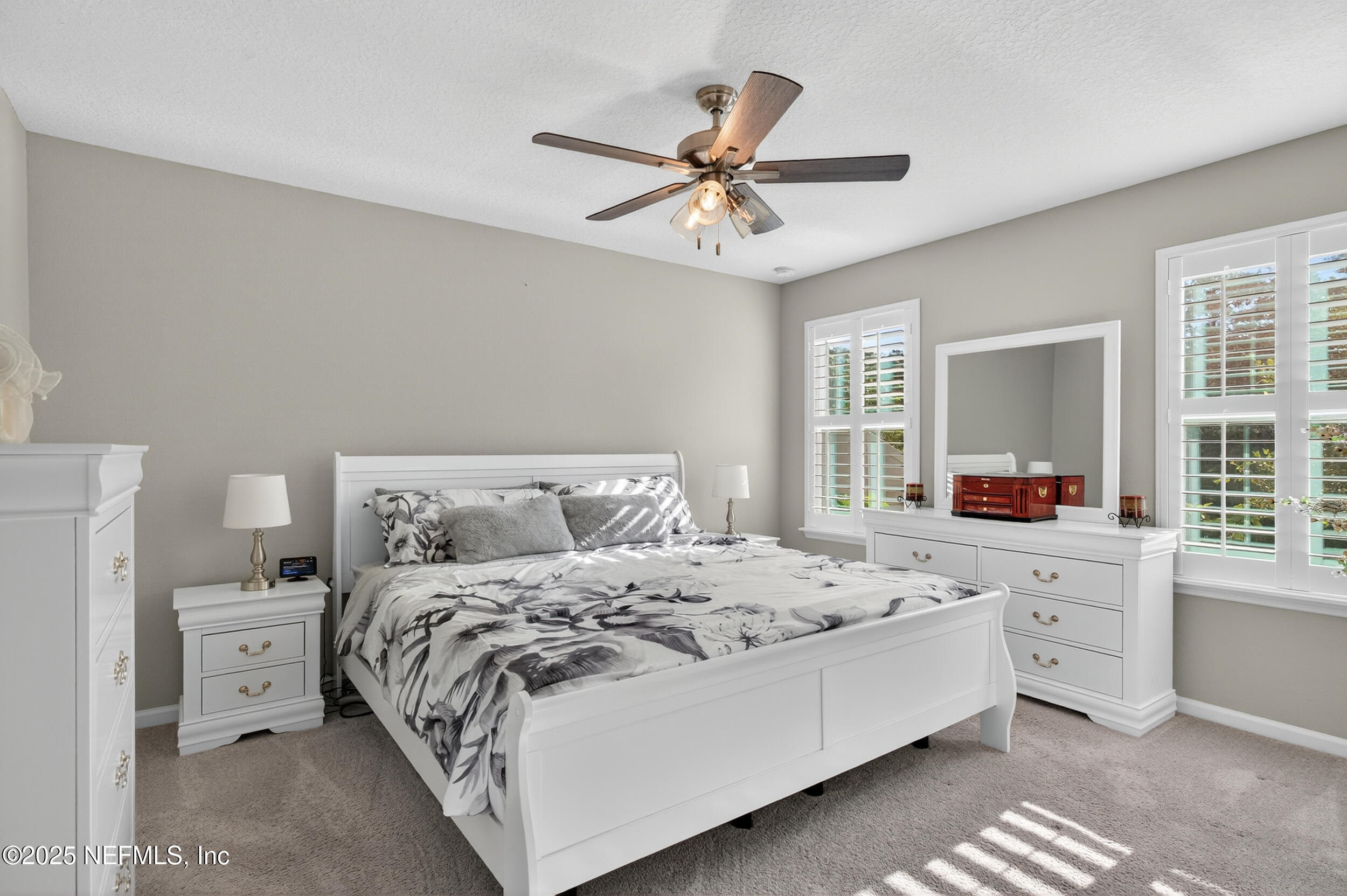 318 Rambling Brk Trail St. Johns, FL 32259 - Photo 15 of 26 a bedroom with a bed and a chandelier