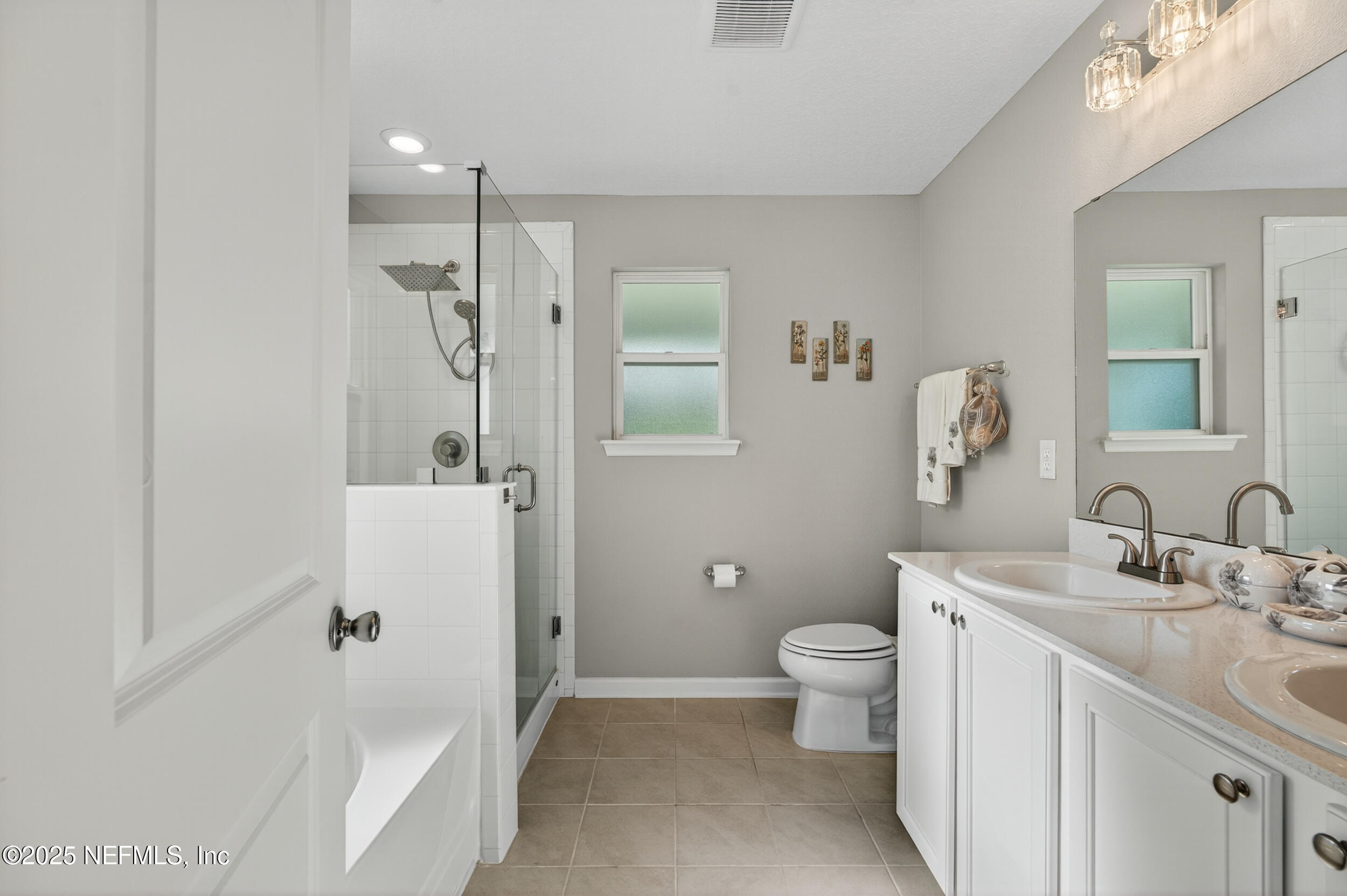 318 Rambling Brk Trail St. Johns, FL 32259 - Photo 17 of 26 a bathroom with a sink a toilet a mirror and shower