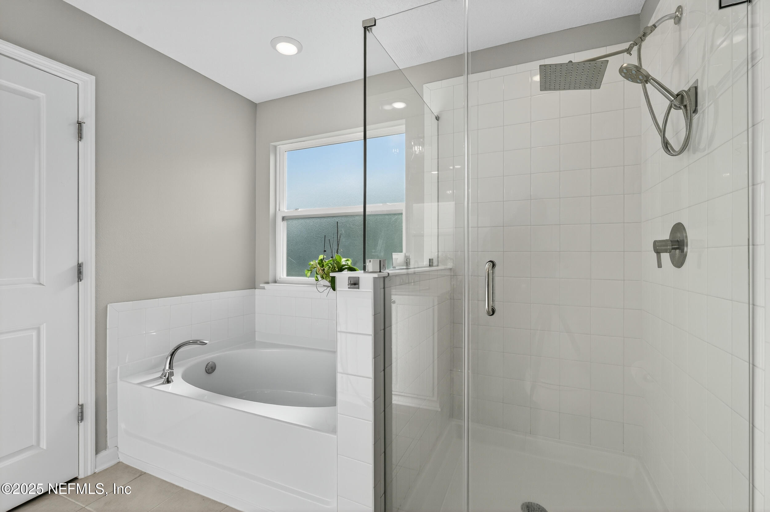 318 Rambling Brk Trail St. Johns, FL 32259 - Photo 18 of 26 a bathroom with a tub and a shower