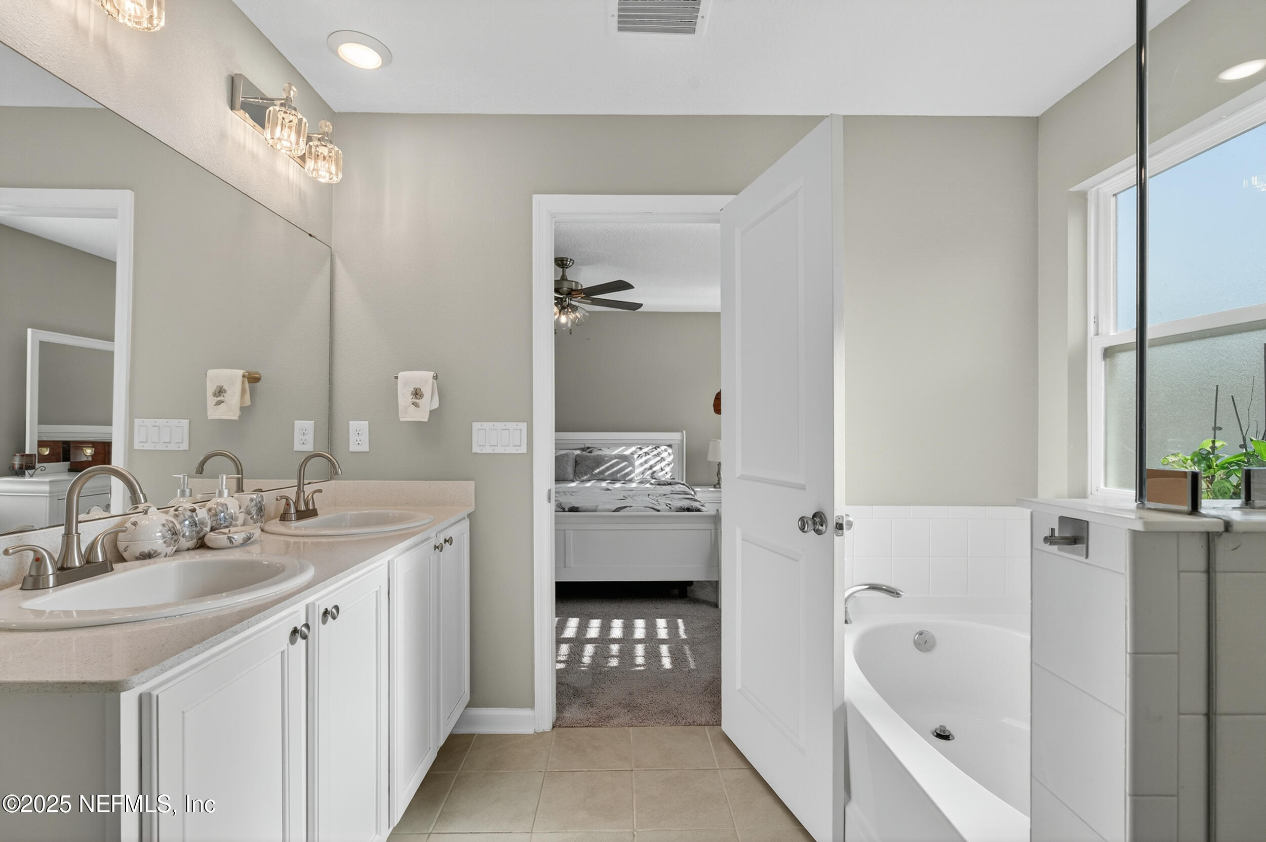 318 Rambling Brk Trail St. Johns, FL 32259 - Photo 19 of 26 a spacious bathroom with a double vanity sink mirror and bathtub