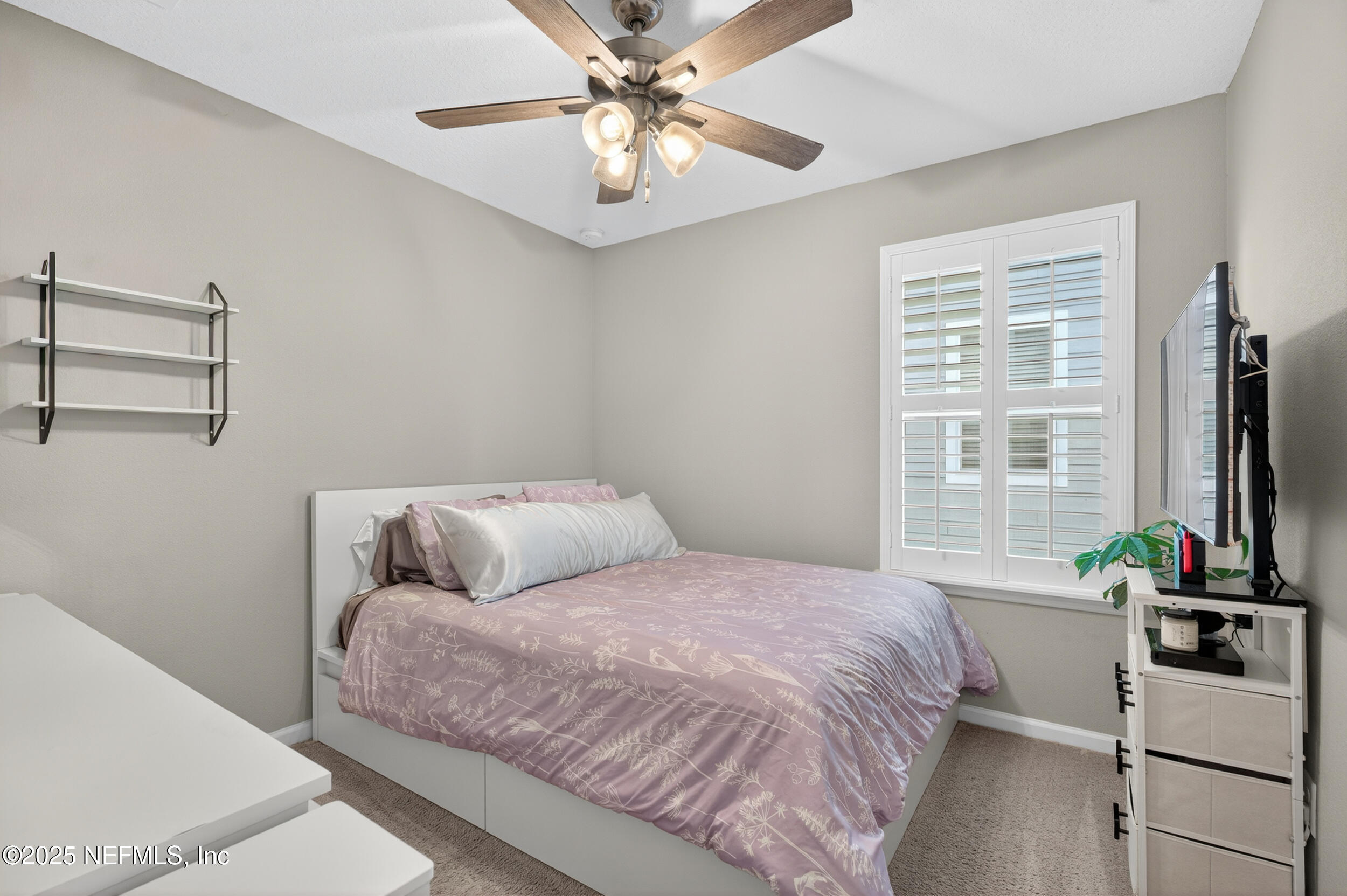 318 Rambling Brk Trail St. Johns, FL 32259 - Photo 21 of 26 a bedroom with a bed and a flat screen tv