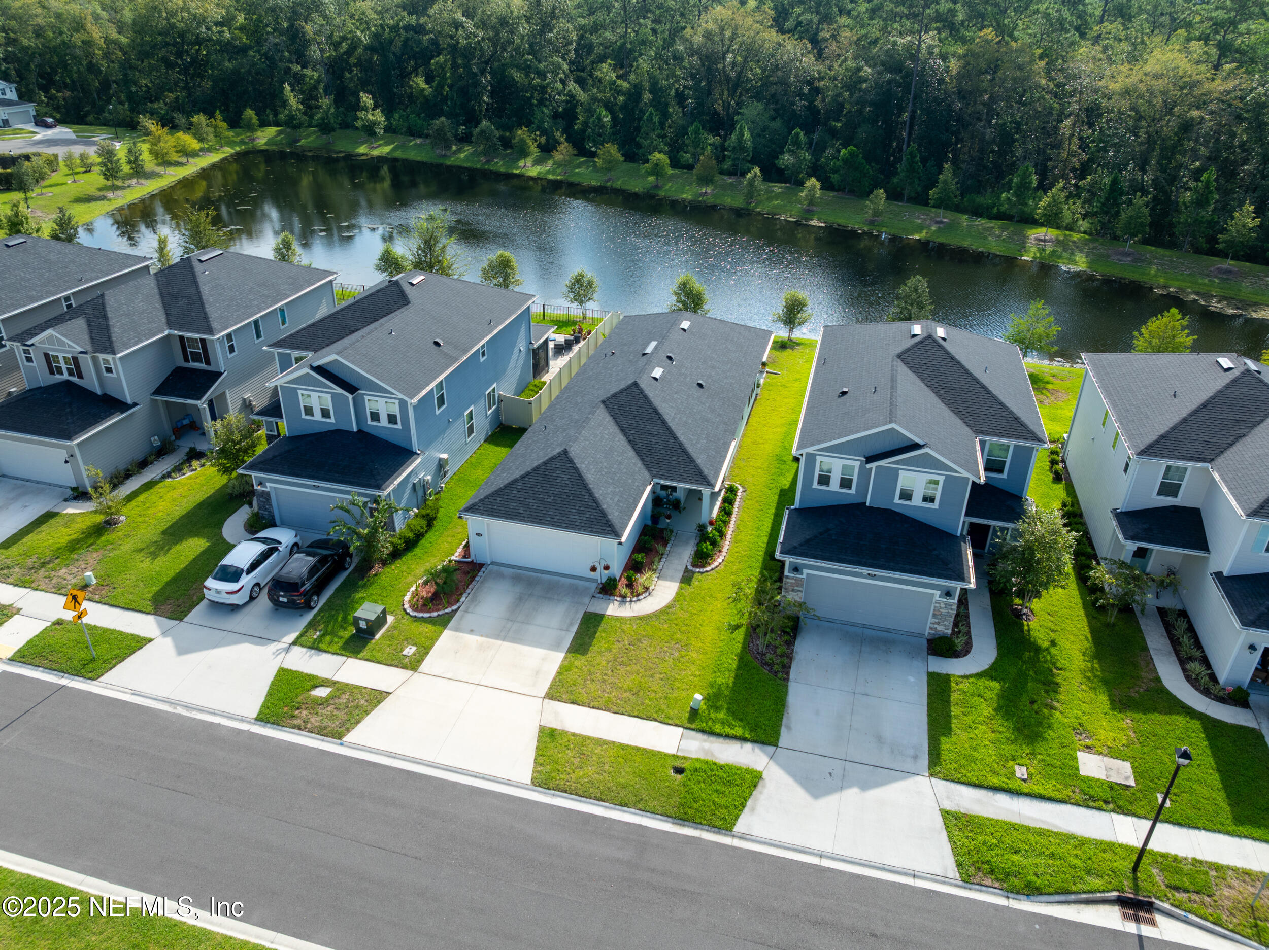 318 Rambling Brk Trail St. Johns, FL 32259 - Photo 3 of 26 an aerial view of a house with swimming pool and outdoor seating