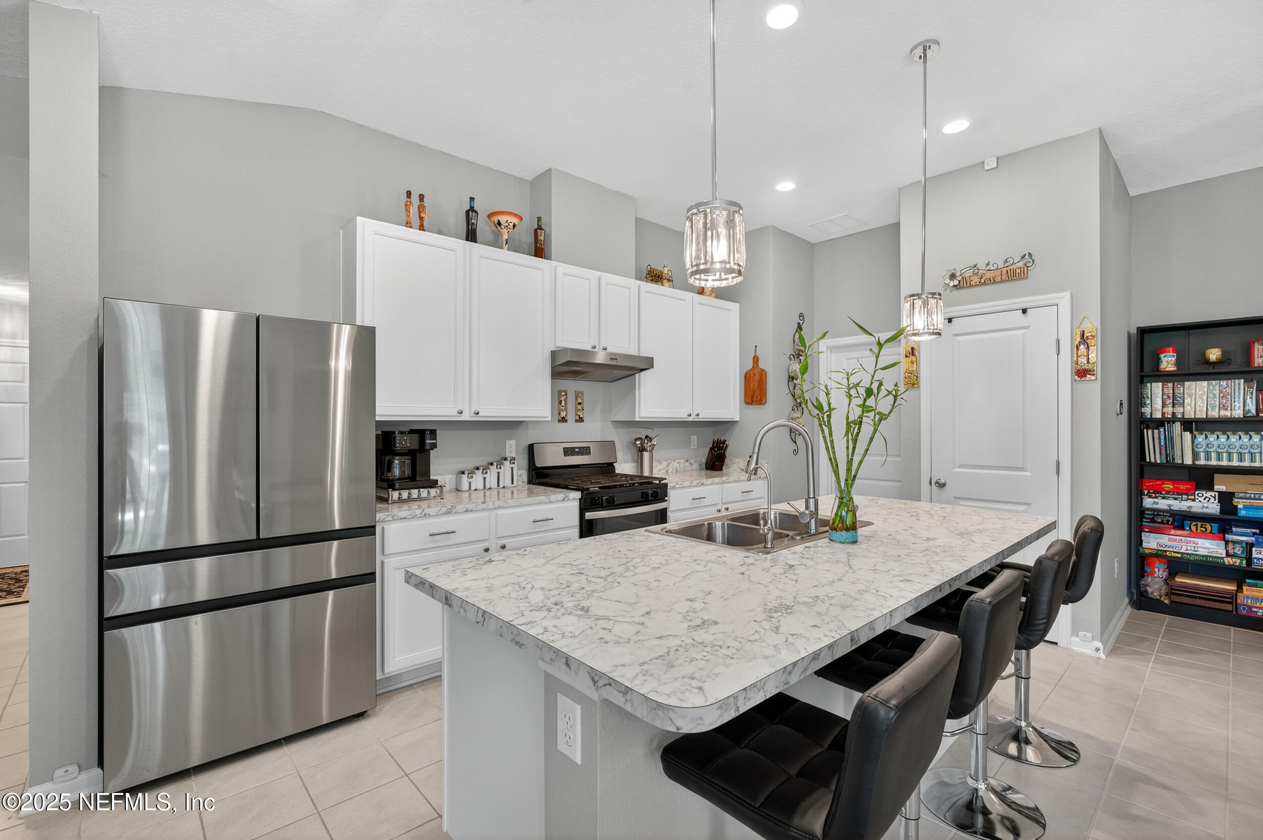 318 Rambling Brk Trail St. Johns, FL 32259 - Photo 10 of 26 a kitchen with refrigerator and countertop