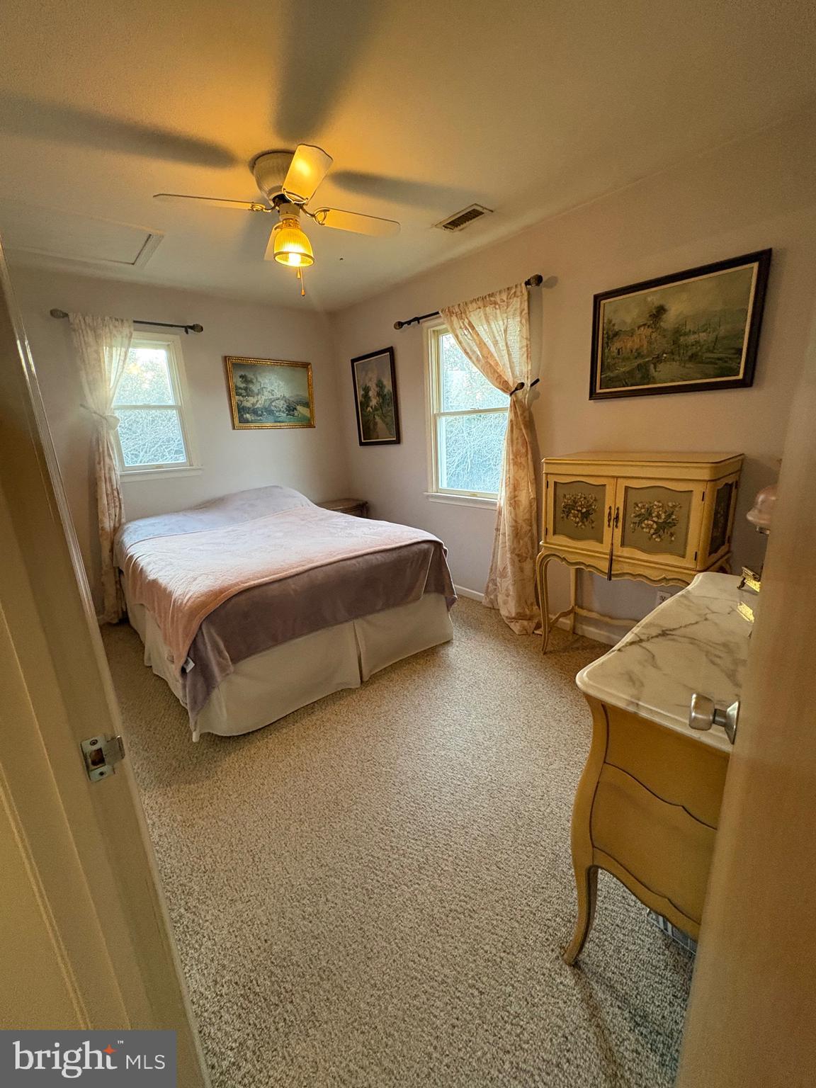 1-2 Harborview Road Lewes, DE 19958 - Photo 34 of 43 a spacious bedroom with a bed and furniture