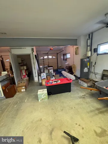 a very nice looking room with many windows and furniture