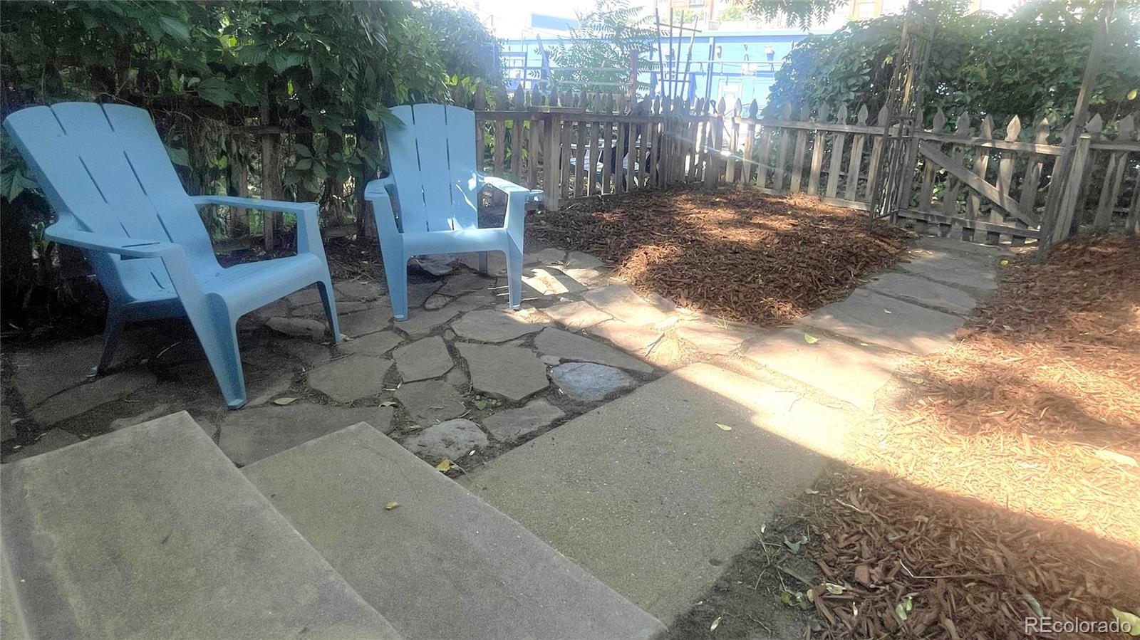 553 Logan Street Denver, CO 80203 - Photo 12 of 38 a view of a two chairs with wooden fence