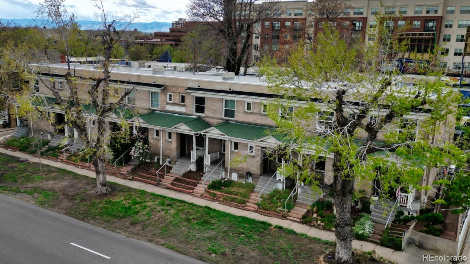 553 Logan Street Denver, CO 80203 - Photo 15 of 38 a view of a house with a yard and sitting area