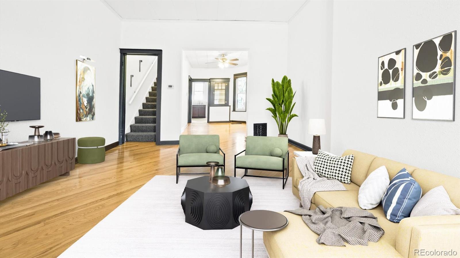 553 Logan Street Denver, CO 80203 - Photo 2 of 38 a living room with furniture and a flat screen tv