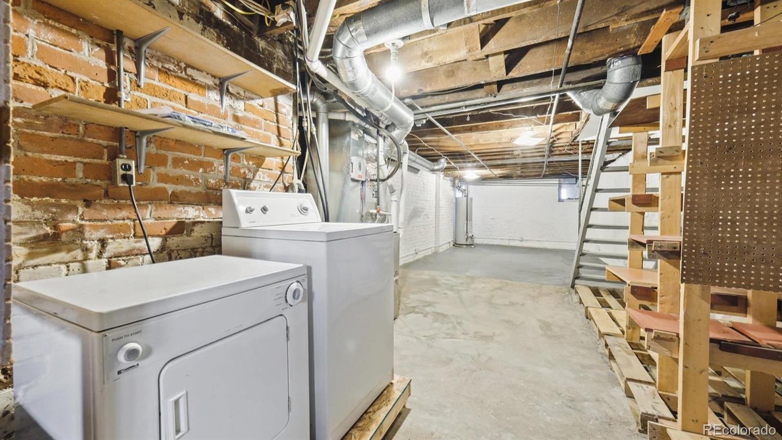 553 Logan Street Denver, CO 80203 - Photo 21 of 38 a utility room with dryer and washer