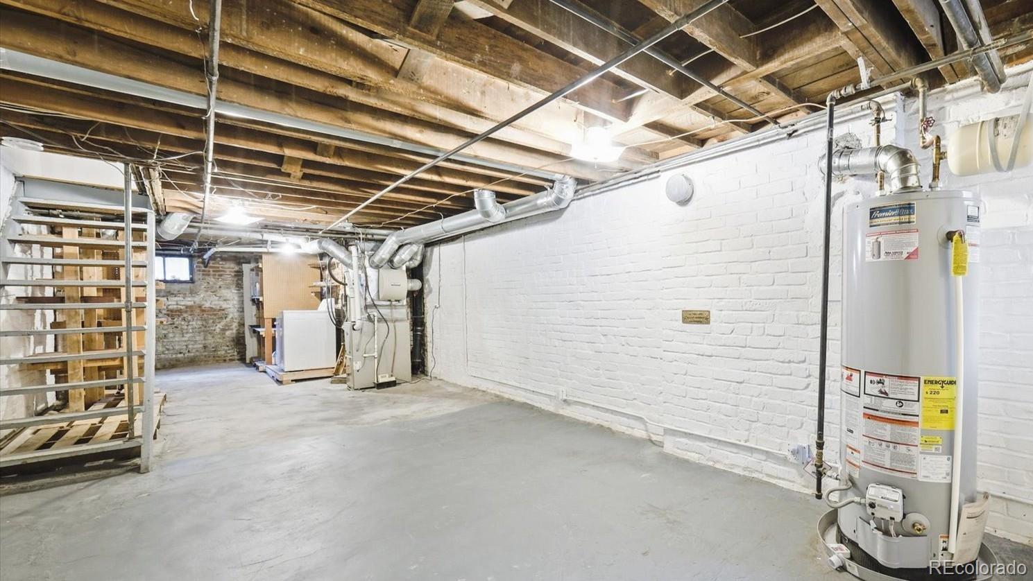 553 Logan Street Denver, CO 80203 - Photo 22 of 38 a view of empty room with wooden ceiling
