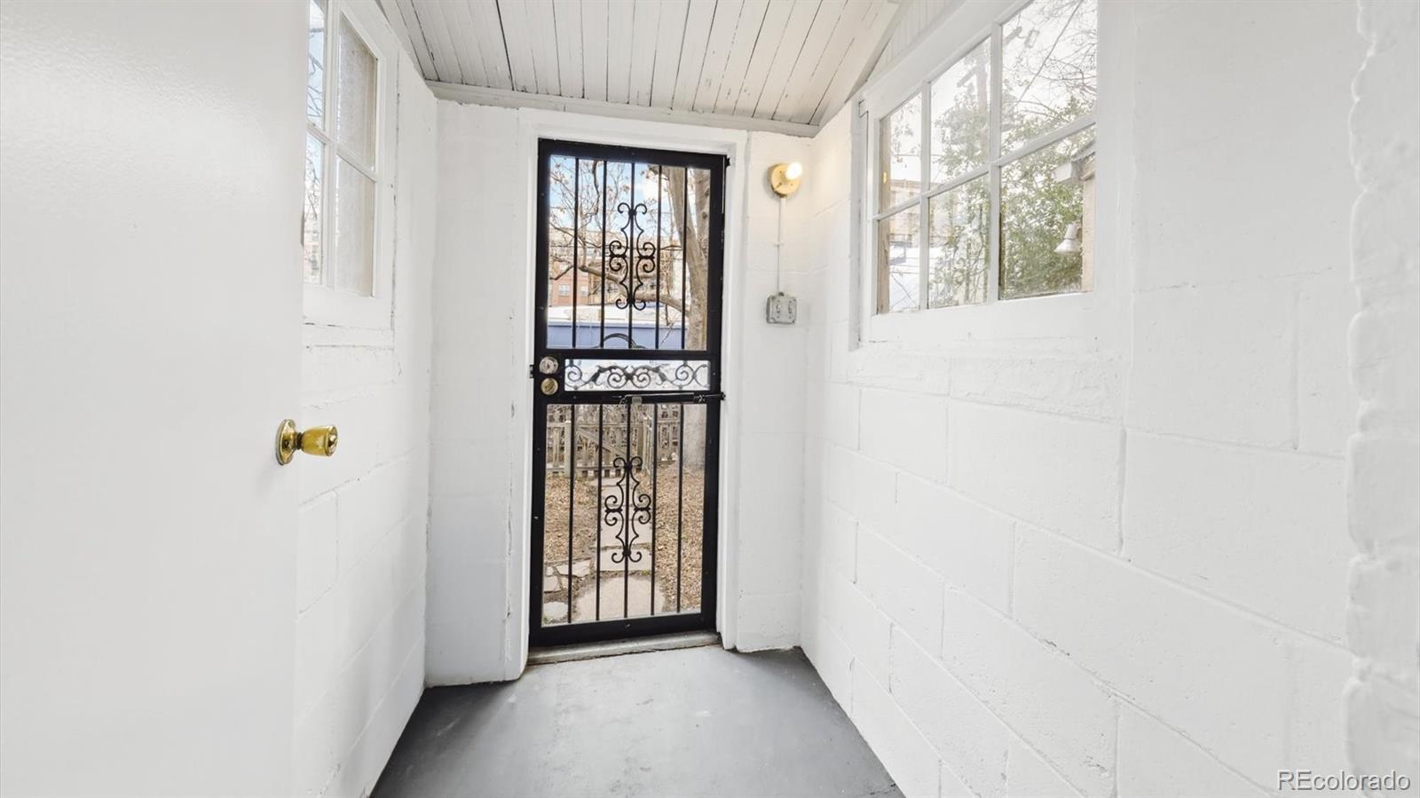 553 Logan Street Denver, CO 80203 - Photo 24 of 38 wooden floor in an empty room with a window