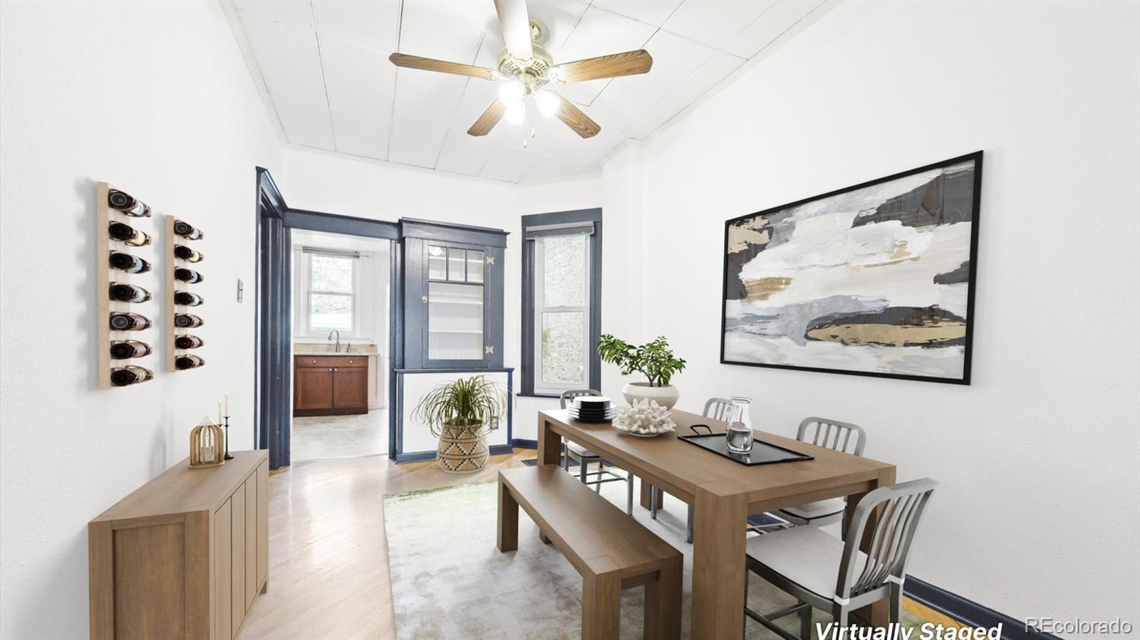 553 Logan Street Denver, CO 80203 - Photo 3 of 38 a view of a livingroom with furniture and window