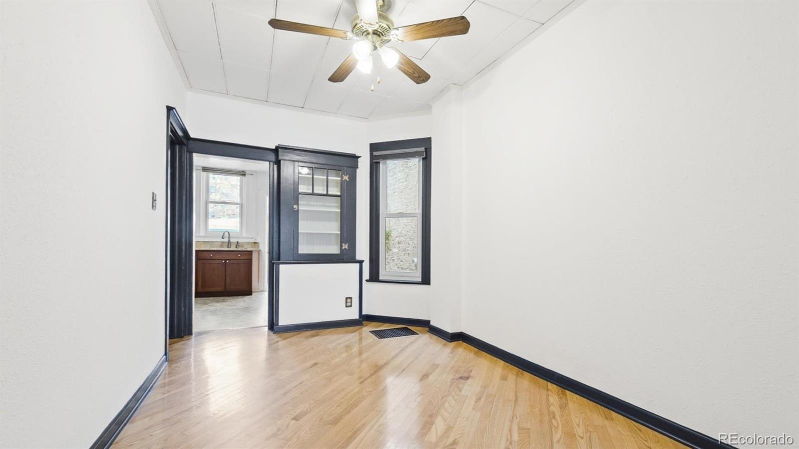 553 Logan Street Denver, CO 80203 - Photo 4 of 38 a view of an empty room with a window