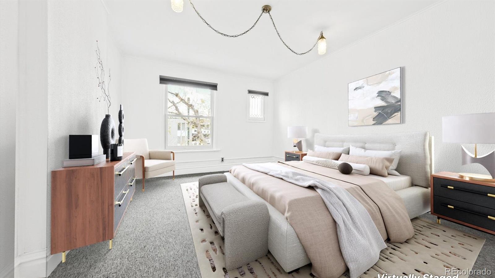 553 Logan Street Denver, CO 80203 - Photo 8 of 38 a bedroom with a bed a couch and dresser