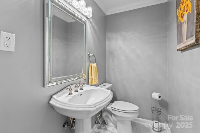 a kitchen with stainless steel appliances granite countertop a sink and a refrigerator