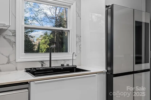a kitchen with a stove and a microwave