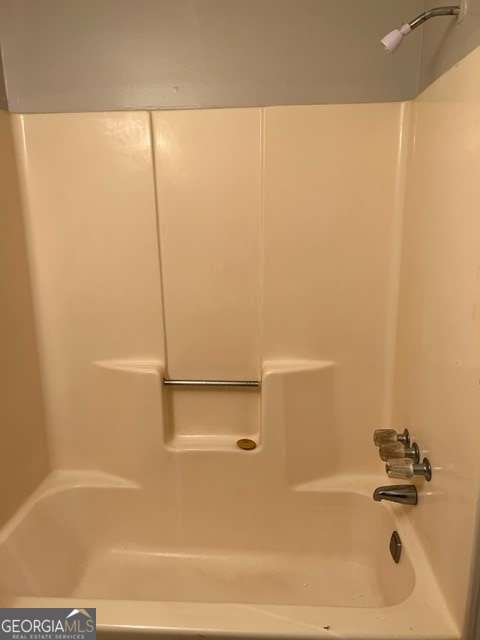 5435 Glen Haven Drive Atlanta, GA 30349 - Photo 11 of 12 a bathroom with a bathtub
