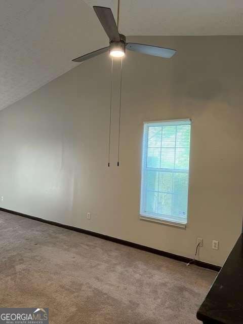 5435 Glen Haven Drive Atlanta, GA 30349 - Photo 4 of 12 an empty room with a ceiling fan and window