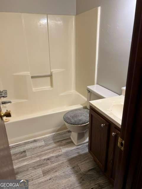5435 Glen Haven Drive Atlanta, GA 30349 - Photo 8 of 12 a bathroom with a sink a toilet and shower
