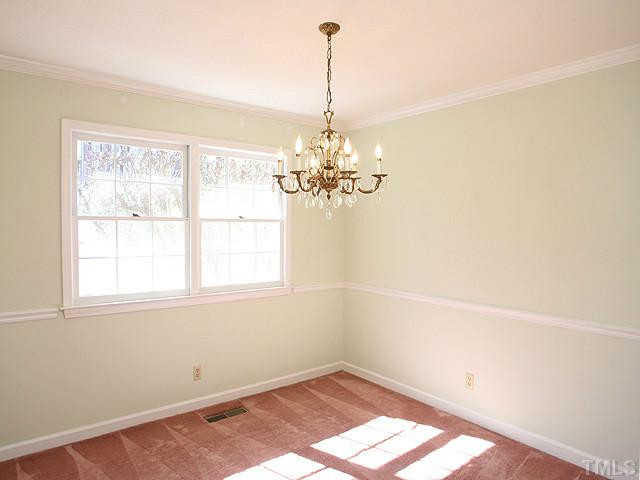 4512 Connell Drive Raleigh, NC 27612 - Photo 5 of 25 Smooth ceilings.....crown molding.....Hardwood Floors under carpet! Dining Room
