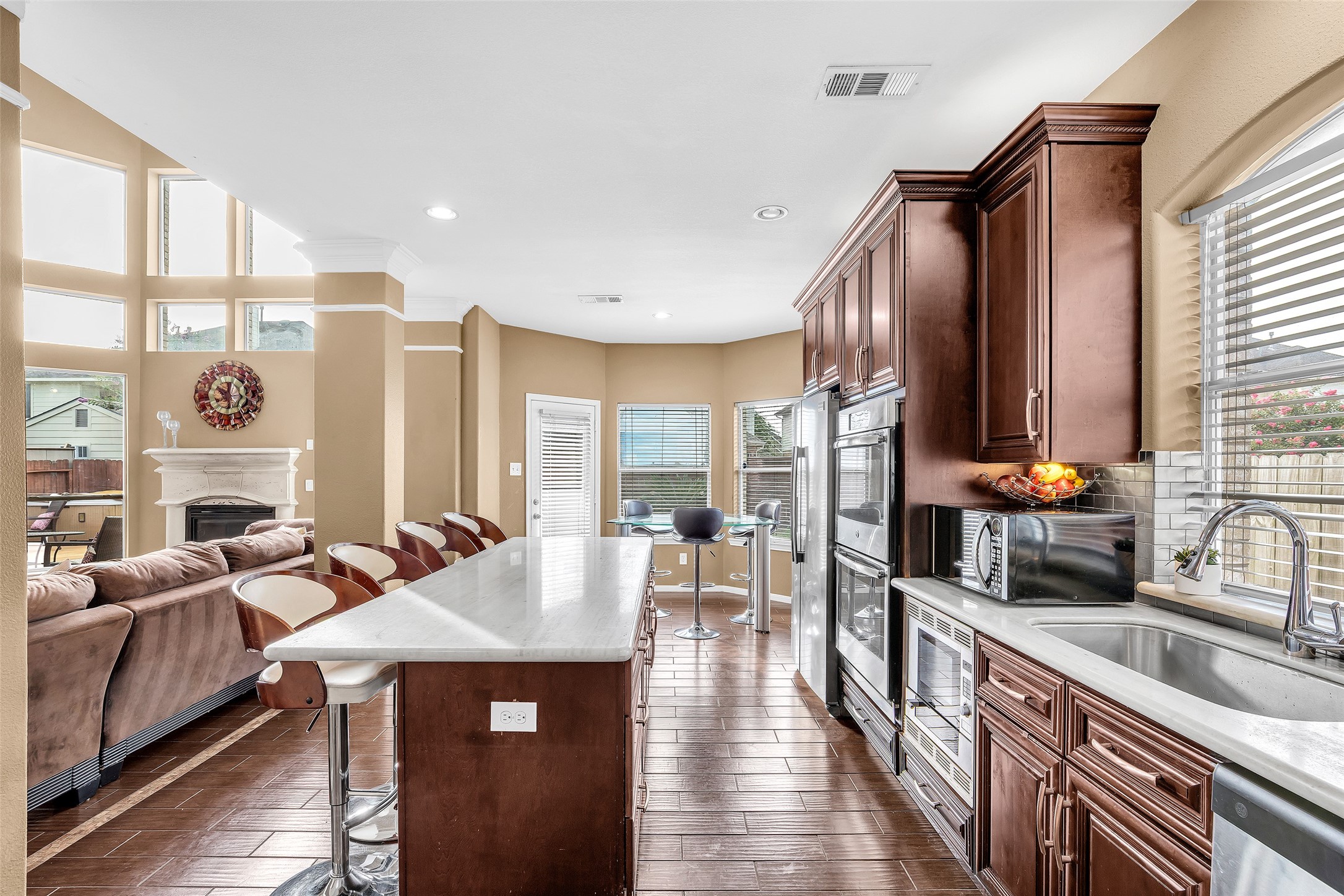611 River Delta Lane Rosenberg, TX 77469 - Photo 3 of 39 a kitchen with stainless steel appliances granite countertop a sink and a refrigerator