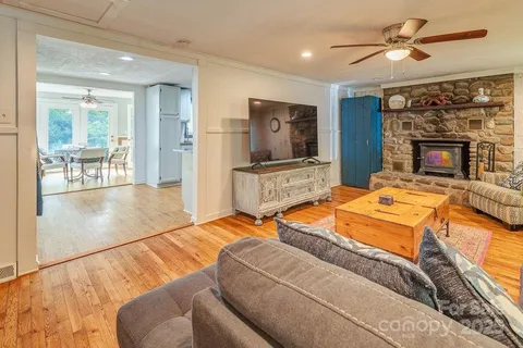 a kitchen with stainless steel appliances granite countertop a stove refrigerator and cabinets