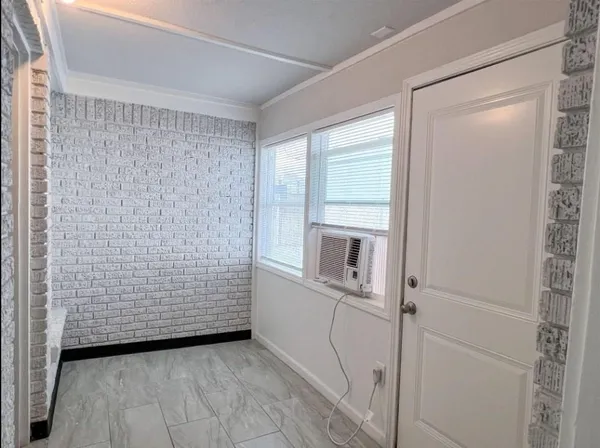 a view of an empty room with a fireplace