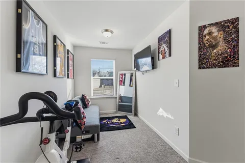a view of a livingroom with furniture and entryway