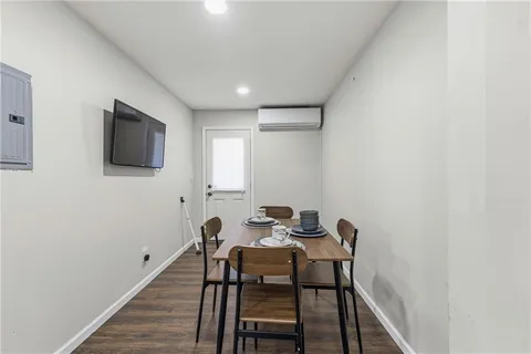 a workspace room with furniture and wooden floor