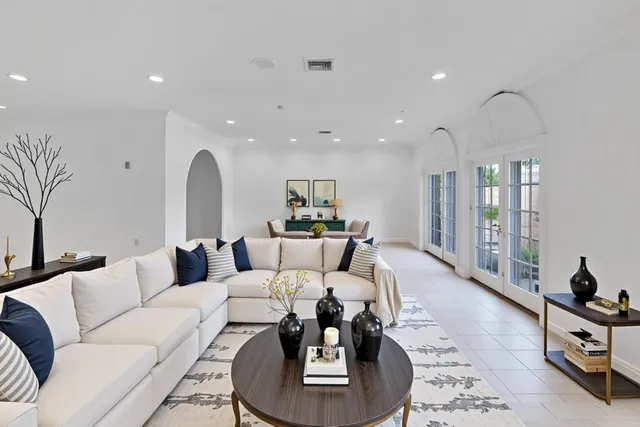 a view of a livingroom with furniture wooden floor and window
