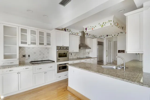 a view of a swimming pool with a lounge chair