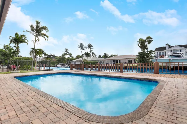 a bathroom with a double vanity sink a mirror and a