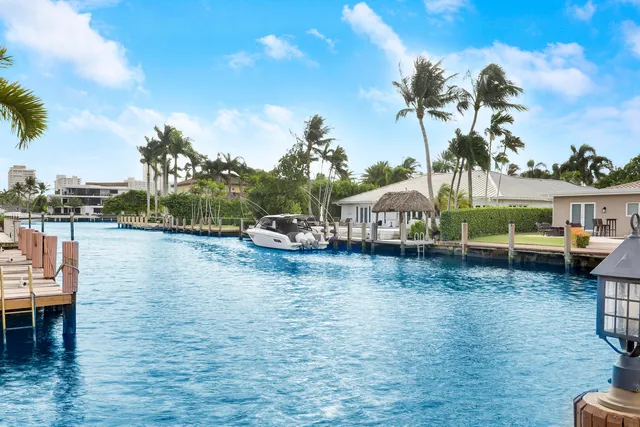 a front view of a house with a yard table and chairs