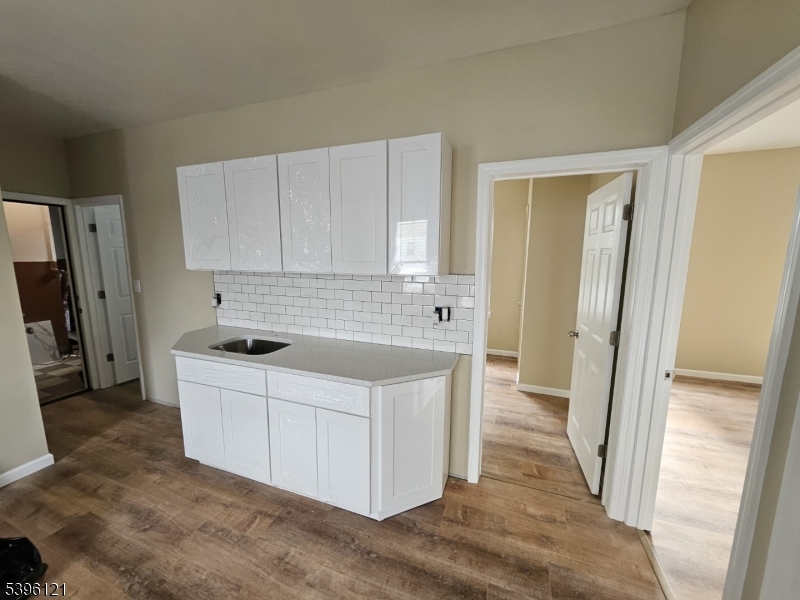 518 East 23rd Street, Unit 2R Paterson, NJ 07514 - Photo 5 of 7 a kitchen with stainless steel appliances a sink stove and refrigerator