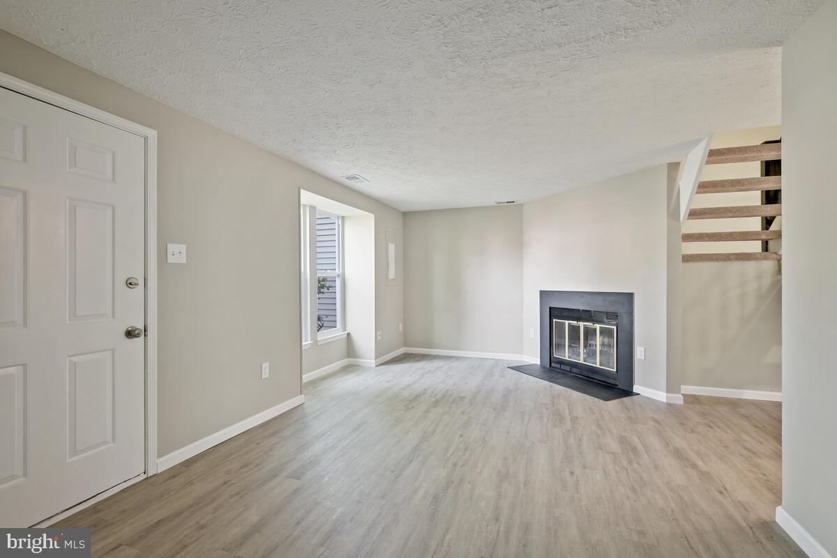 522 Riggs Court Frederick, MD 21703 - Photo 5 of 30 Living Room w/ Cozy Fireplace