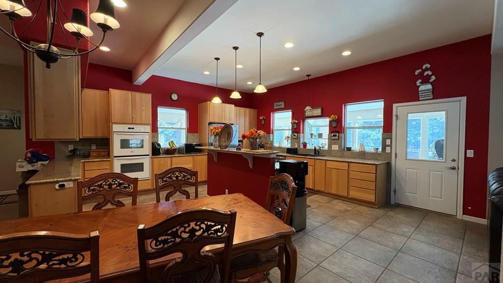 8295 Green Lane Rye, CO 81069 - Photo 18 of 88 a very nice looking kitchen with a large counter space a large window and stainless steel appliances