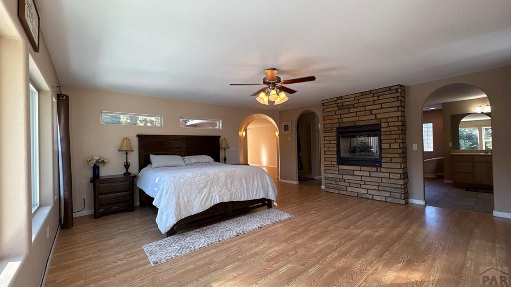 8295 Green Lane Rye, CO 81069 - Photo 65 of 88 a bedroom with a bed and a chandelier