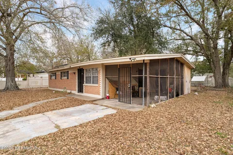 a view of a house with a yard and garage