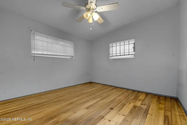 a view of room with window and ceiling fan