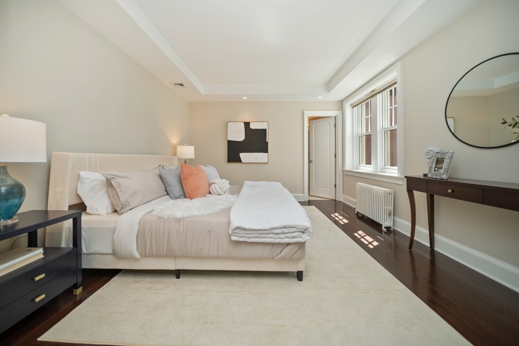 56 Commonwealth Avenue, Unit PH Boston, MA 02116 - Photo 17 of 33 a bedroom with bed and a large window