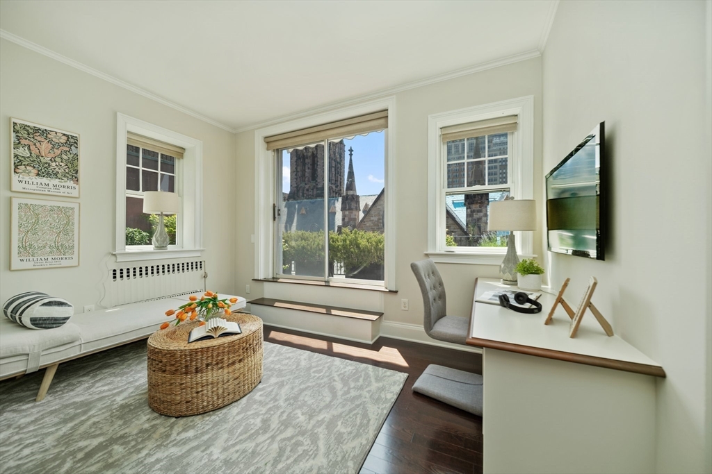 56 Commonwealth Avenue, Unit PH Boston, MA 02116 - Photo 20 of 33 a living room with furniture and flat screen tv