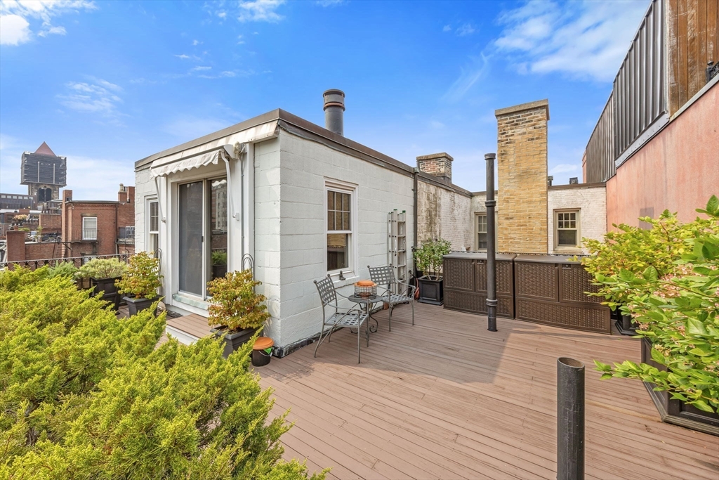 56 Commonwealth Avenue, Unit PH Boston, MA 02116 - Photo 24 of 33 a view of a house with patio outdoor seating