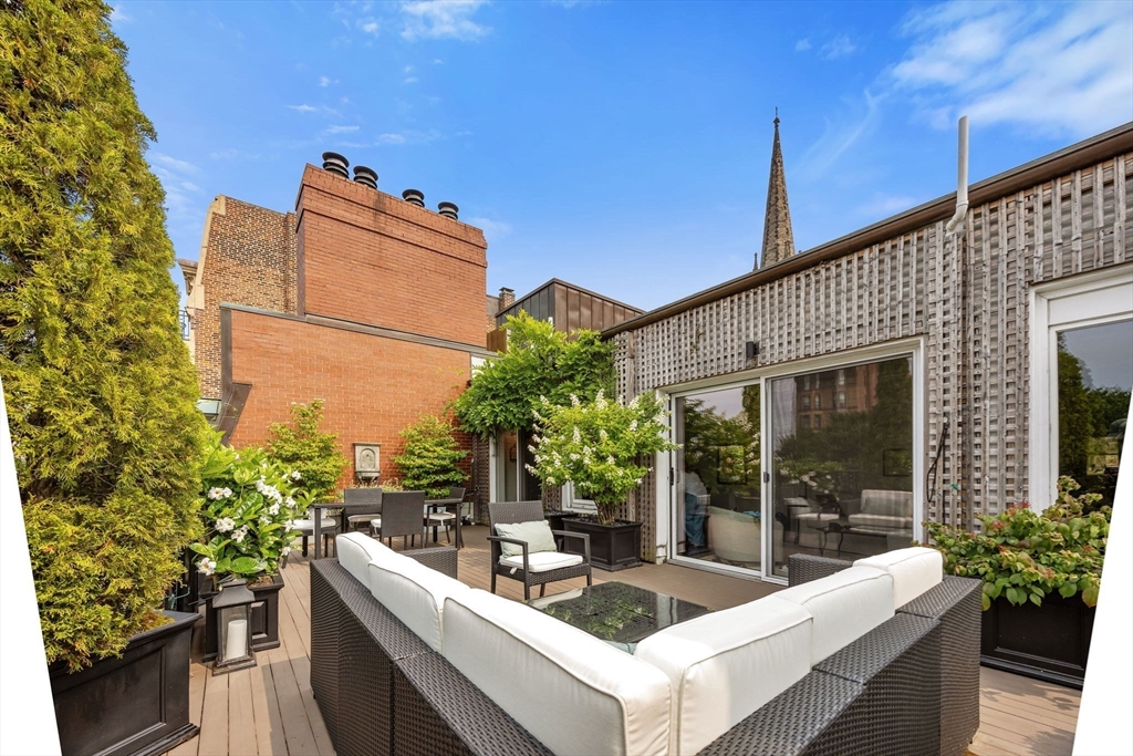 56 Commonwealth Avenue, Unit PH Boston, MA 02116 - Photo 4 of 33 a view of a couches in patio of the house